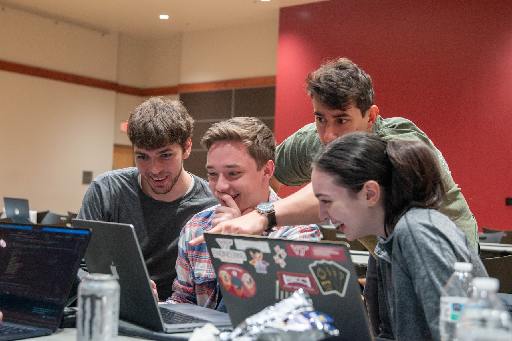 Students coding a hackathon project